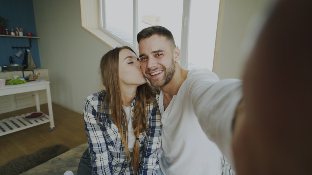 A couple sits at their dining table in a sunlit home, thoughtfully reviewing paperwork, representing empowered Columbus homeowners making smart financial decisions.